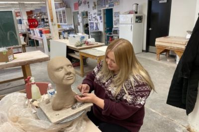 Students work on ceramics art projects