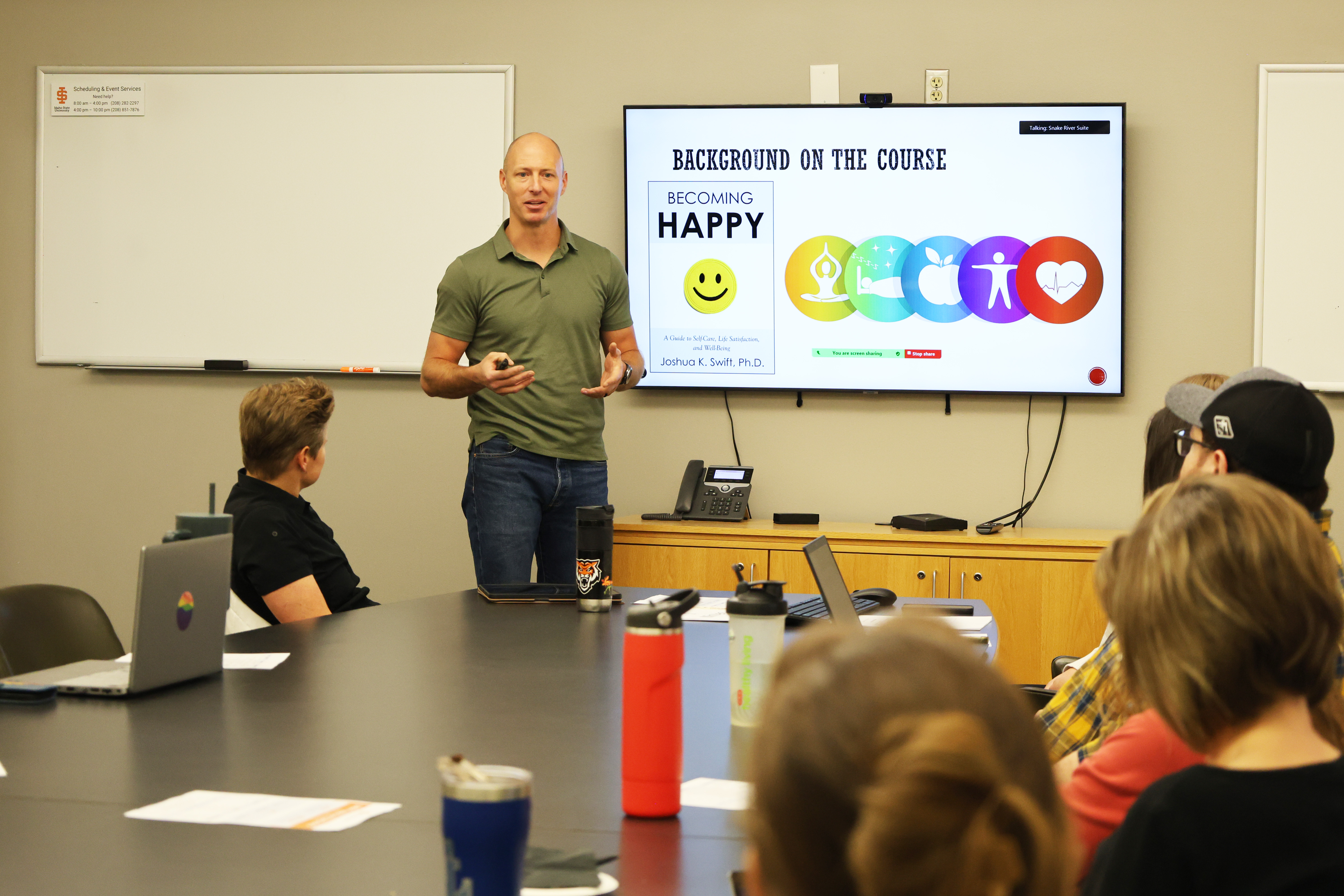 Professor giving a presentation in front of a group