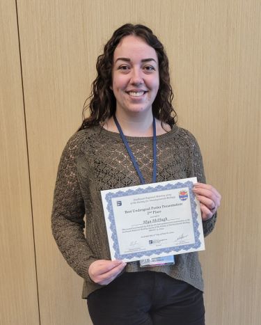 Mya McHugh showing off her Student spotlight Award