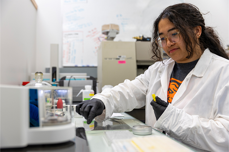 Haskell Distajo, graduate student, poses for photos in the Stable Isotope Laboratory on Idaho State University’s Pocatello campus.