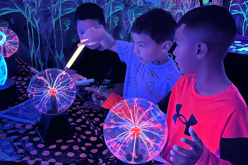 Students participate in an activity during a field trip to the 2024 Haunted Science Laboratory.