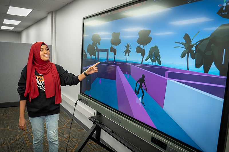 Rifat Ara Tasnim, doctoral student at Idaho State University, explains some of the elements of Militant of the Maze, a serious game she developed.
