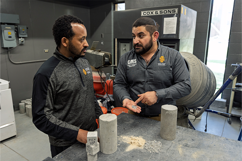 Tadesse Wakjira, a researcher in the civil and environmental engineering department at Idaho State University and the Center for Advanced Energy Studies, and Mustafa Mashal, professor of civil engineering and lead inventor of Sweetcrete, pose for photos in the Concrete and Asphalt Lab on ISU's Pocatello campus.