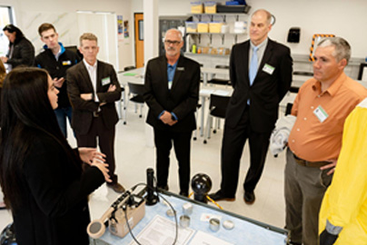 Industry partners observing a demonstration at a TAC meeting