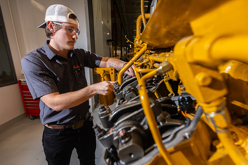 Diesel/On-Site Power Generation Technology student working on a generator