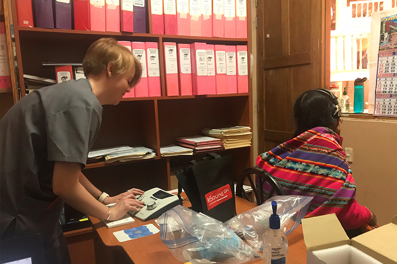 Bailey Neuhaus, ISU Audiology student conducting hearing screenings in Peru as part of a humanitarian mission with Idaho Condor