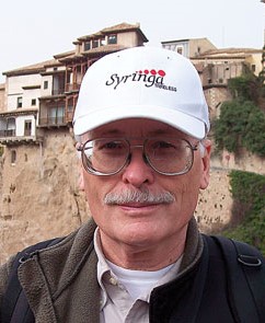 A headshot image of J.B.