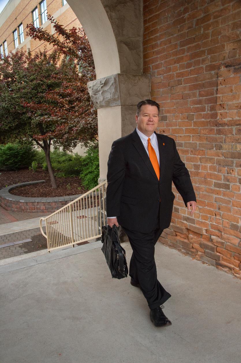 Kevin Satterlee walking through Swanson Arch