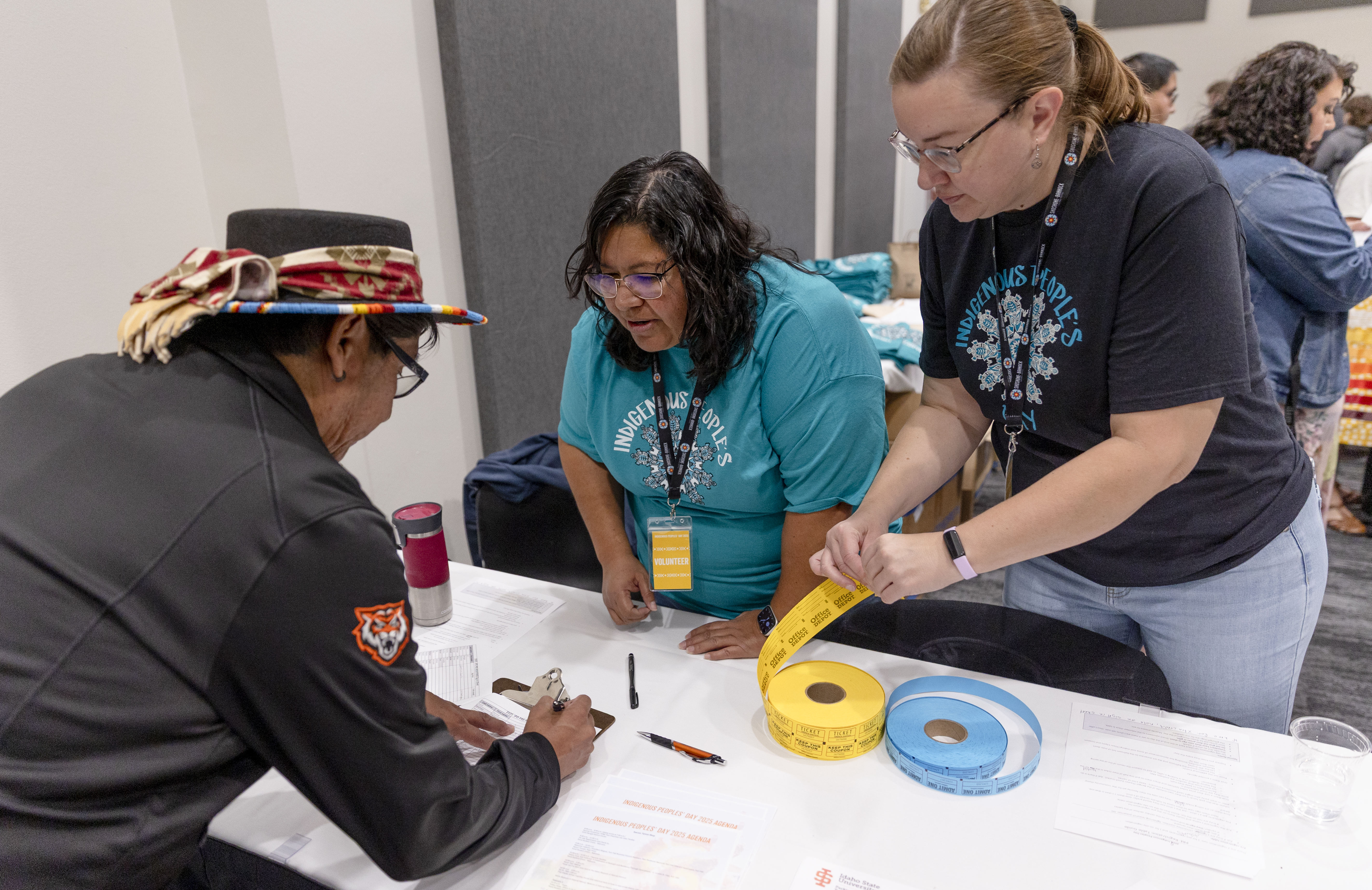 People signing in at ISU's Indigenous People's Day event.