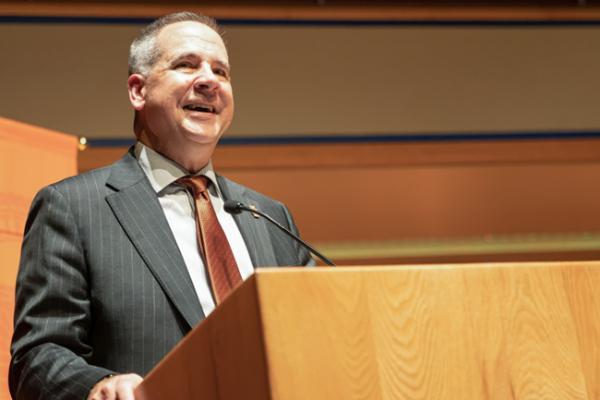 ISU President Robert Wagner standing at a podium