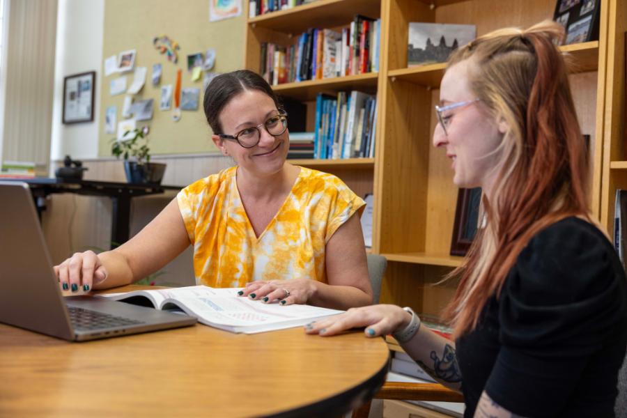 Professor Kristin Van De Griend helps a student