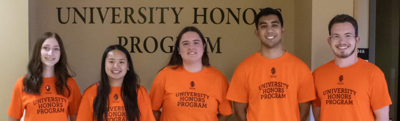 5 Honors students standing in a row wearing roarange University Honors program Tshirts