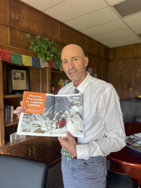 Darin Jernigan with magazine featuring his research and image